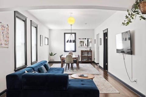 Bright and airy living space with modern décor, cozy seating, and a dedicated dining area.