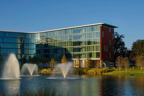 With its elegant glass façade and lakeside fountains, Hotel ELEO offers a luxurious retreat, inviting guests to unwind in style.