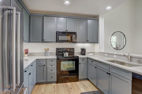 A sleek kitchen design brings modern sophistication to mountain living—ideal for cooking up comfort after a day outdoors.