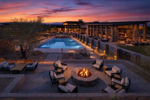 Communal Area: Resort-style pools and spa with outdoor seating, fire pit, and cafe