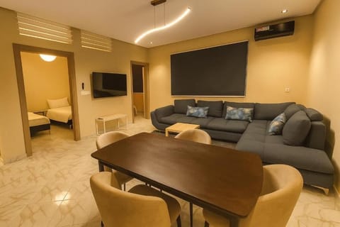Family Suite, Hill View | Living area | 59-inch Smart TV with cable channels