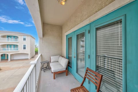Your private balcony offers comfortable seating where you can relax with morning coffee while enjoying coastal breezes and peaceful neighborhood views.