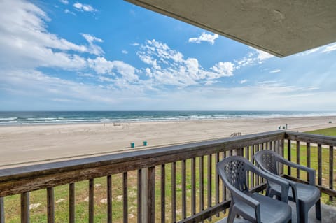Stunning oceanfront balcony with sweeping beach views and comfortable seating for your morning coffee or sunset relaxation.