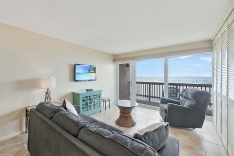 Your oceanfront living room opens to breathtaking sea views where you can unwind on plush seating while listening to waves.