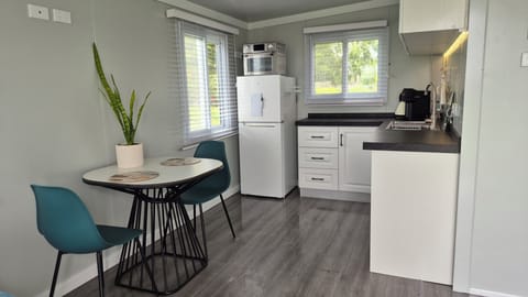 Full kitchen with fridge, oven/air fryer, counter and cupboards