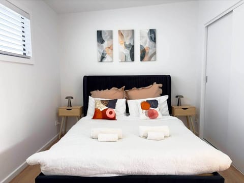 Peaceful bedroom with a comfortable bed, designed for a restful night’s sleep.