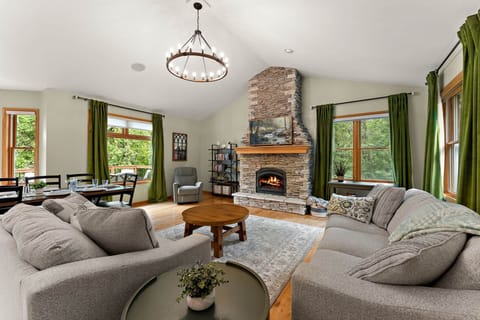 The open concept great room is a perfect place to gather and enjoy river views.