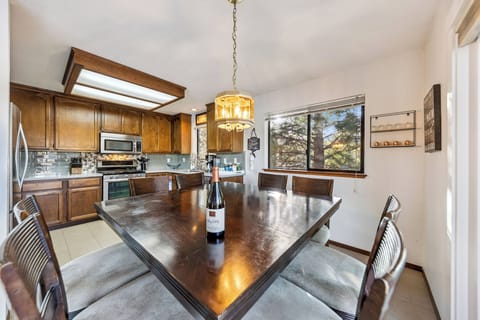 Cozy kitchen dining area with seating for eight, perfect for shared meals and easy gatherings.
