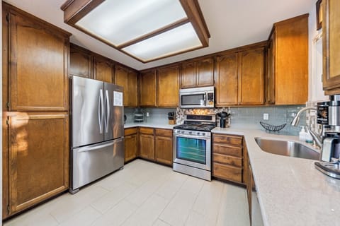 Updated kitchen with granite counters, stainless appliances, and all the essentials for easy family meals.