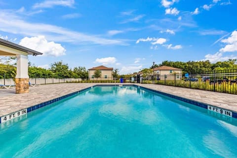 Community swimming pool located close to the home for convenient guest access.