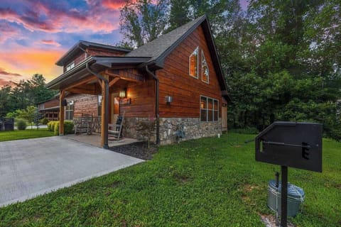 Pull into your driveway as the sky turns pink and gold behind the cabin — this is the welcome you get most evenings here.