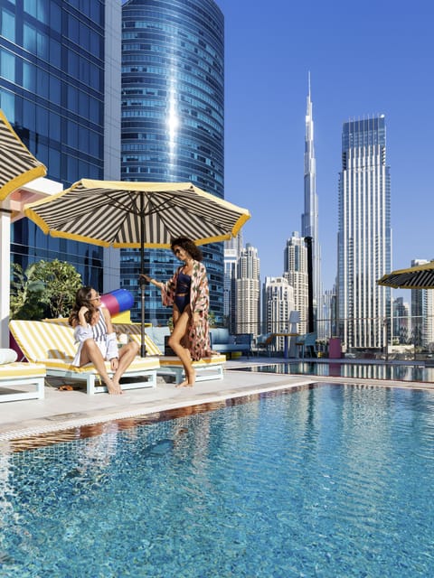 Outdoor pool, pool umbrellas, sun loungers
