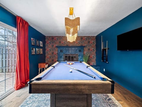 Game room fun w/ a pool table, vibrant colors & a laid-back setup for friendly competition 🎱😄