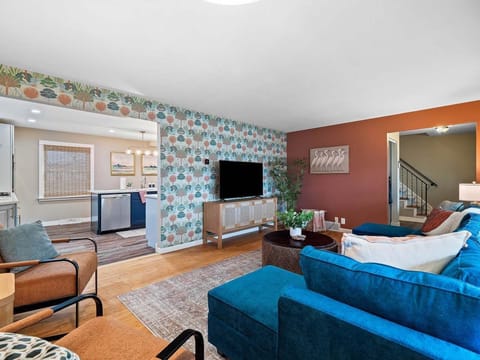 Stylish lounge w/ patterned walls, comfy sofas & a great spot to unwind after a full day 📺🌿Stylish lounge w/ patterned walls, comfy sofas & a great spot to unwind after a full day 📺🌿