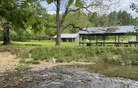 Exterior with large covered pavilion next to Saw Creek