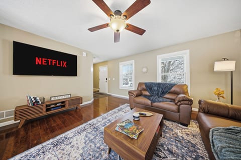 Open Living Room with 65" Smart TV for entertaining
