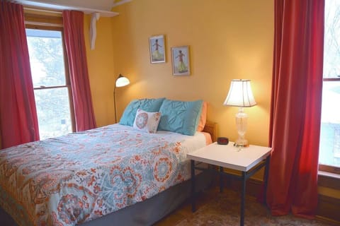Yellow room. **This room now has a QUEEN bed and two side tables. Updated photos coming soon. - 3/1/24**