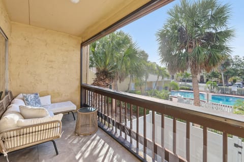 Private screened lanai overlooking the pool, perfect for morning coffee.