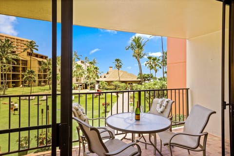 Enjoy your morning coffee or evening wine with a view of the lush, palm-filled grounds. Your perfect spot for relaxation.