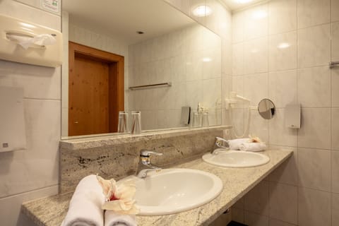 Hair dryer, bathrobes, towels, soap