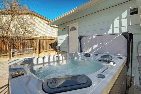 The private hot tub sits just off the patio, offering a warm and relaxing spot to soak and enjoy the fresh Colorado air.