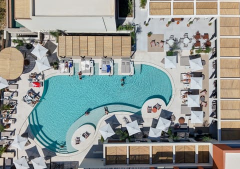 Seasonal outdoor pool, open 9:00 AM to 8:00 PM, pool umbrellas