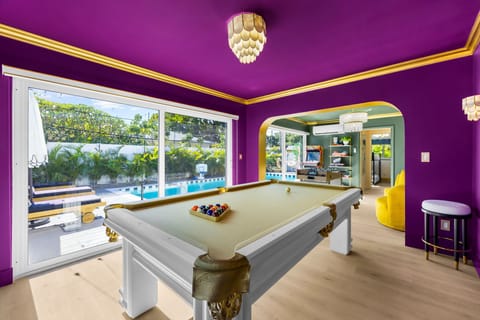Enjoy a fun game of pool while staying right in the middle of the action with views of the backyard pool and quick access to the arcade and foosball nearby!
