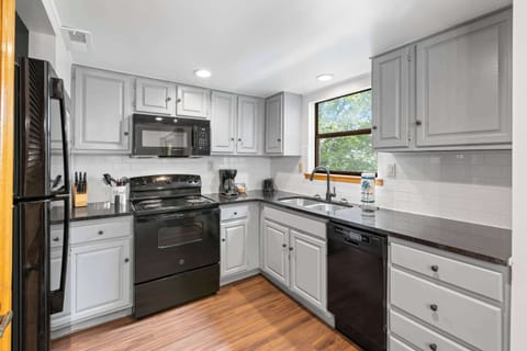 Modern appliances and sunlit views make cooking a pleasure in Pigeon Forge!