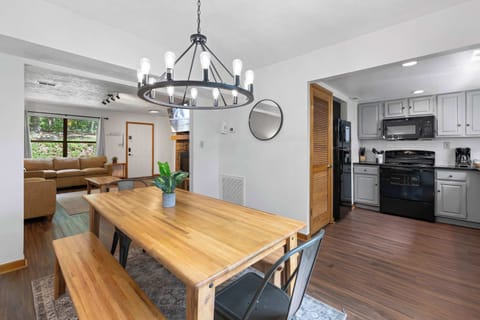 Gather around the stylish table for meals and memories in this open-concept space!