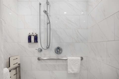 The bathrooms come with rails, toiletries, and a shower.