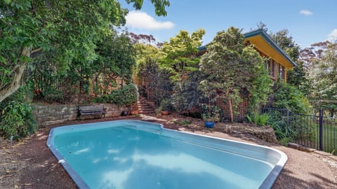 Sparkling pool nestled in a beautifully landscaped garden.