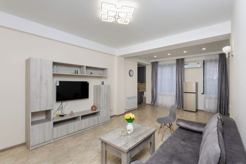 Economy Cottage | Living area | 50-inch flat-screen TV with cable channels