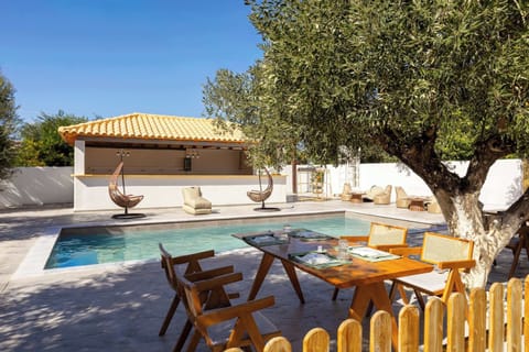 Shared Pool Terrace with Sun Loungers Under the Olive Trees
Relaxing communal pool area with shaded seating and Mediterranean garden surroundings.