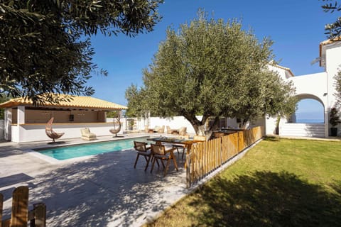 Shared Pool Area with Olive Trees and Sun Loungers
Beautiful communal pool surrounded by greenery and natural stone details.
