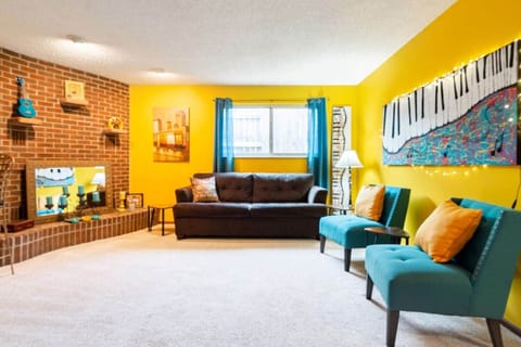 Musical living room. The brown couch pulls out into a double bed.