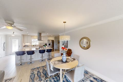 Breakfast bar seats four and dining table seats four