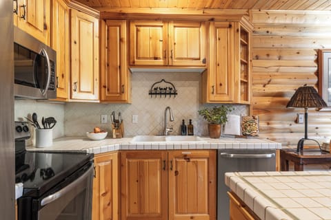 Kitchen with modern appliances and ample cabinetry.