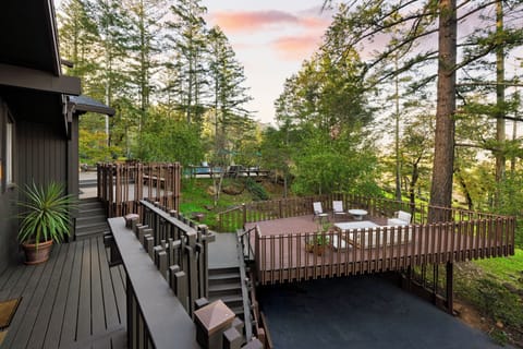 Unwind and enjoy forest views from the deck.