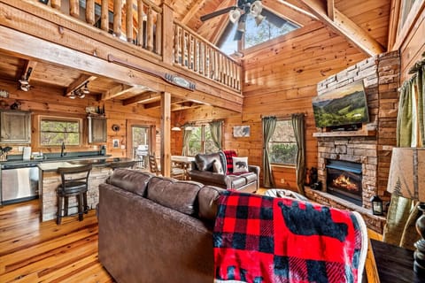 Enjoy open-concept living with plenty of space to relax, cook, and connect. From the warm wood finishes to the rustic stone accents, this space feels like home in the mountains.