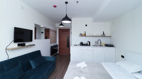A huge, wide mirror adds depth and brightness to the space.