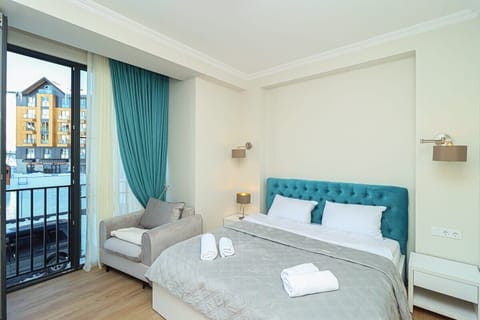 Bedroom features a king-size bed with fresh linens.