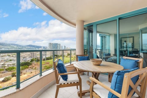 Enjoy mountain views from this balcony with outdoor seating