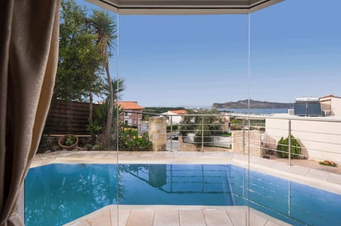 Serene Interiors Overlooking Pool and Sea