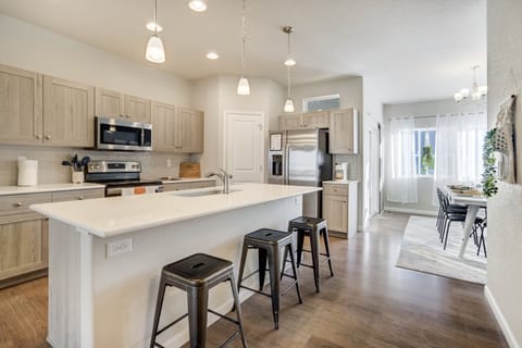 The fully stocked kitchen includes stainless steel appliances, modern finishes, and a Keurig for your morning coffee.