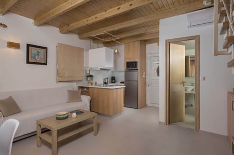 Fully Equipped Kitchen and Inviting Living Room for Your Comfort