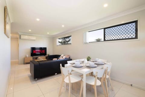 Dining Area: Integrated dining area within open living layout 