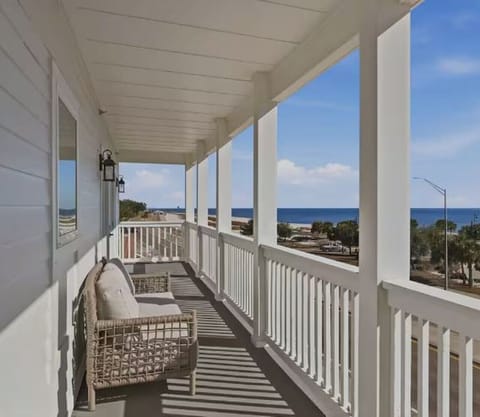Private balcony seating with relaxing harbor and coastal views.