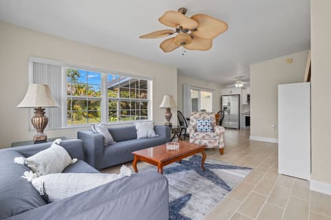 Recently renovated, sophisticated yet inviting spacious living area with great flow into the kitchen, dining and screened in lanai.  50` Roku TV for all your streaming pleasures.  All new floors, kitchen and bathroom.