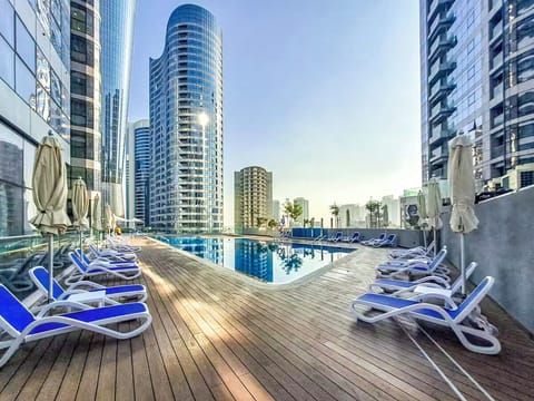 Outdoor pool, pool umbrellas, sun loungers
