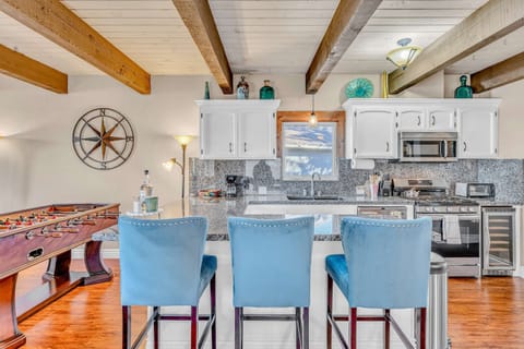 Kitchen: Drip coffee maker, toaster oven, cooking utensils, tableware